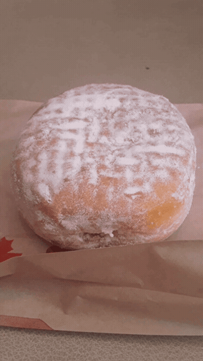 Powdered Sugar Donut On Paper With Red Star GIF