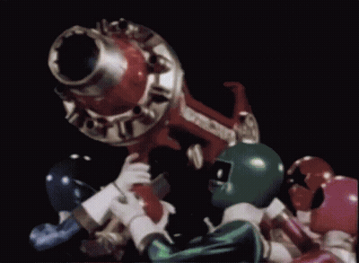 Power Rangers Standing Around Cannon In Dark Room GIF