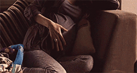 Pregnancy Woman Belly Pain Couch  GIF