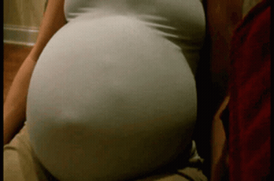 Pregnant Woman Sitting On Couch GIF