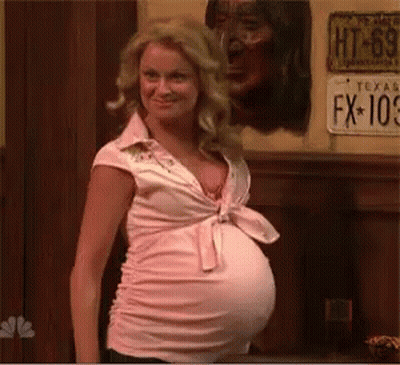 Pregnant Woman Standing By License Plate GIF