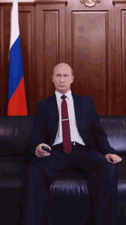 President Vladimir Putin Turning On Tv Using Remote