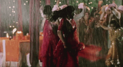 Pretty Indian Ladies Dancing In Monsoon GIF