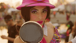Pretty Lady Holding Magnifying Glass GIF