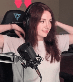 Pretty Woman Warming Up Her Back GIF
