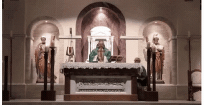 Priest At Church Altar With Statues GIF