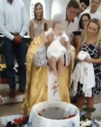 Priest Holding Baby At Baptism GIF