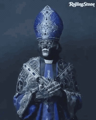 Priest With Mask Holding Cross GIF