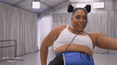 Prime Video Model In White Top And Blue Shorts GIF
