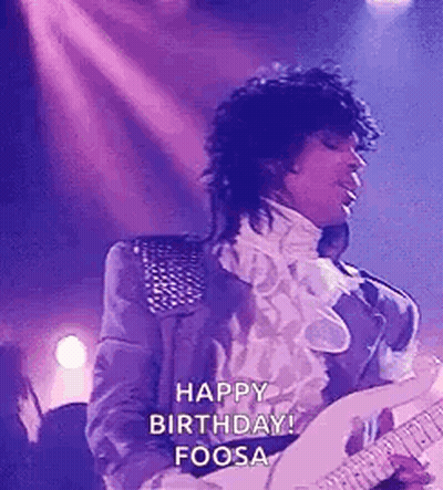 Prince Is Playing A Guitar On Stage And Saying Happy Birthday . GIF