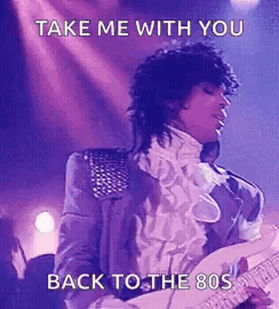 Prince Is Playing A Guitar On Stage And Singing . GIF