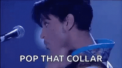 Prince Is Singing Into A Microphone With The Words Pop That Collar . GIF
