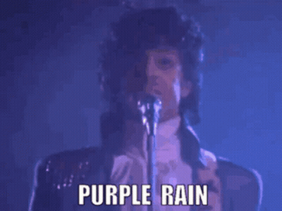 Prince Singing Into A Microphone With The Words Purple Rain Below Him GIF