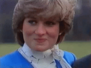 Princess Diana Is Wearing A Blue Jacket And White Collared Shirt . GIF