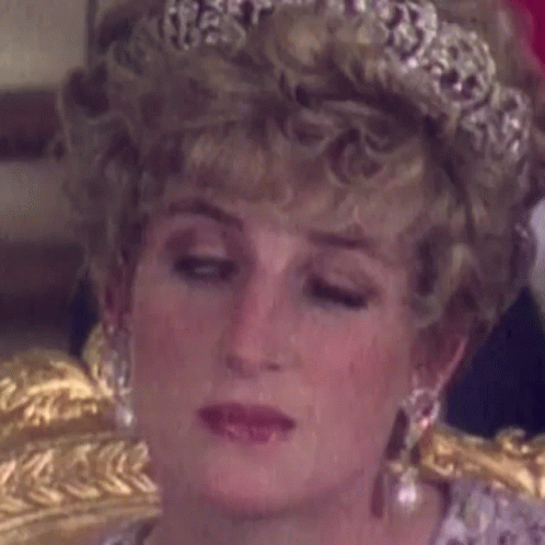 Princess Diana Is Wearing A Tiara And Earrings . GIF
