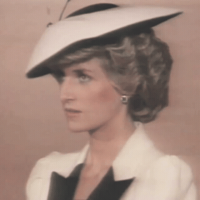 Princess Diana Wearing White Hat And Black Jacket GIF