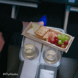 Prosecco With Sides Of Grapes And Crackers GIF