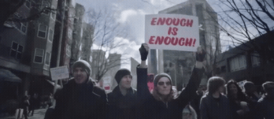 Protester Holding Enough Is Enough Sign GIF