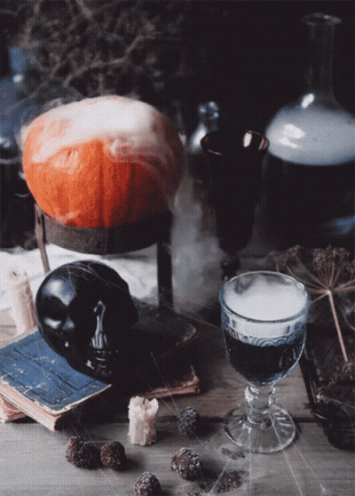 Pumpkin On Stand Next To Glass Of Wine GIF