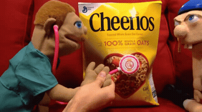 Puppet Examining Bag Of Cheerios GIF
