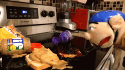 Puppet Heating Up Peanut Butter Sandwich GIF
