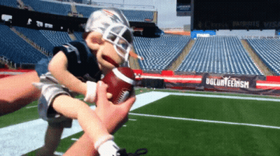 Puppet Holding Football In Front Of Volunteerism Sign GIF