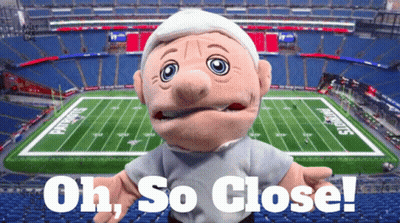 Puppet In Front Of Football Field Saying Oh So Close GIF
