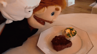 Puppet Looking At Plate Of Steak GIF