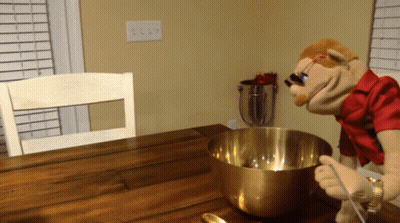 Puppet Mixing In Metal Bowl With Spoon GIF