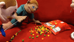 Puppet Smocking On Skittles Candy GIF