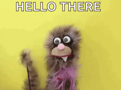 Puppet With Big Eyes And Pink Bow Tie Waving Hello There GIF
