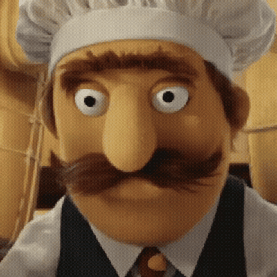Puppet With Chef Hat Close Up GIF