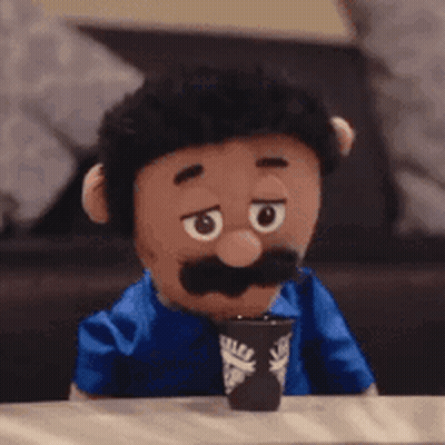 Puppet With Mustache Holding Coffee GIF