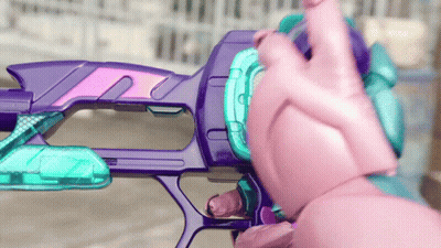 Purple And Pink Toy Gun Held By Pink Hand GIF
