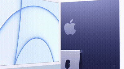 Purple Apple Computer Next To White Computer GIF