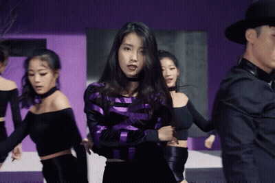 Purple Black Striped Woman Surrounded By Women GIF