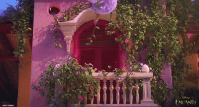 Purple Building With Balcony And Flowers GIF
