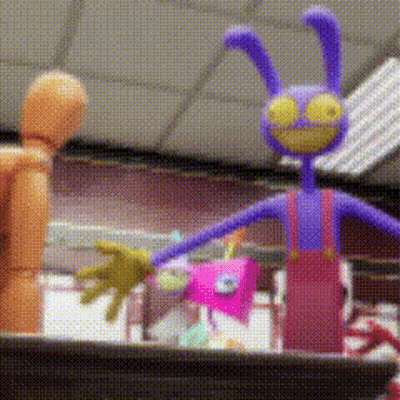 Purple Bunny Toy Next To Wooden Mannequin GIF