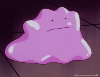Purple Cartoon Character Sitting On Table GIF