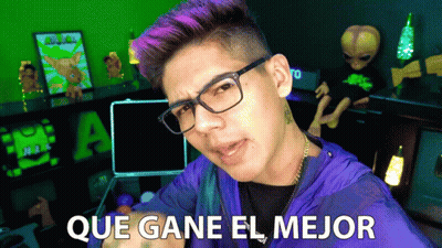 Purple-Haired Man Glasses Says Que Gane El Mejor GIF