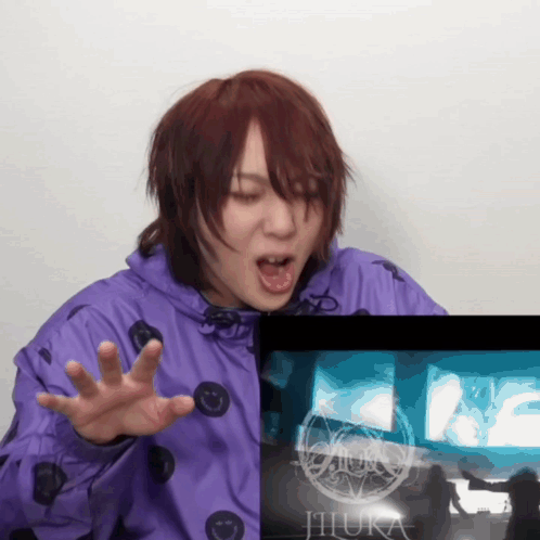 Purple Jacket Woman Funny Face Beside Screen Saying Jihura GIF