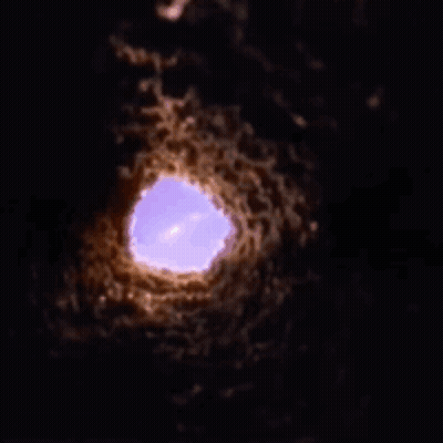 Purple Light Shining Through Hole In Ground GIF