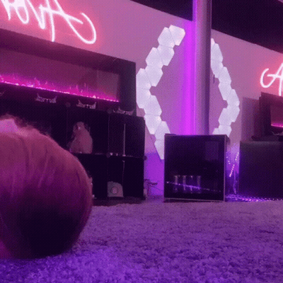 Purple Lit Room With A Sign GIF