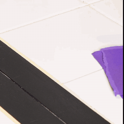 Purple Paper On Tiled Floor GIF