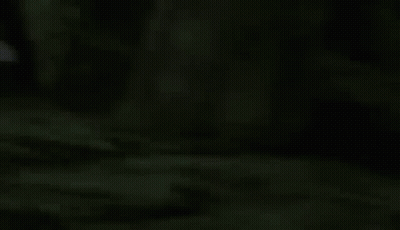Purple Robot With Sword And Shield Walking In Dark GIF