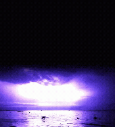 Purple Sky Over Water With Boats GIF