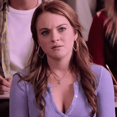 Purple Sweater Woman With Hoop Earrings In Classroom GIF