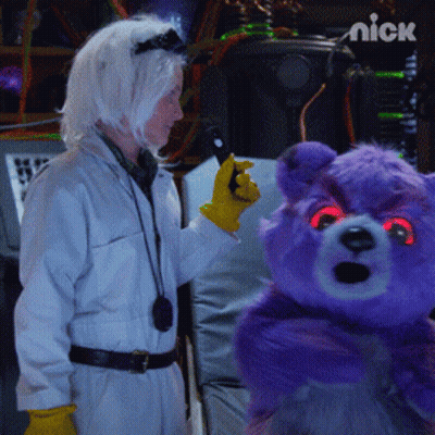 Purple Teddy Bear With Red Eyes Held By Woman In Lab Coat GIF