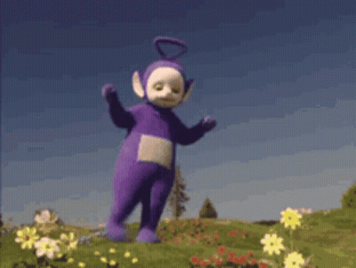 Purple Teletubby Teddy Bear Dancing In Flowers GIF