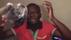 Putting On Tinfoil Hat While Crying GIF